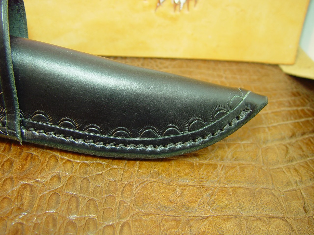 Custom cross draw knife sheath for the buck Selkirk knife. The sheath is made out of water buffalo hide leather Black.