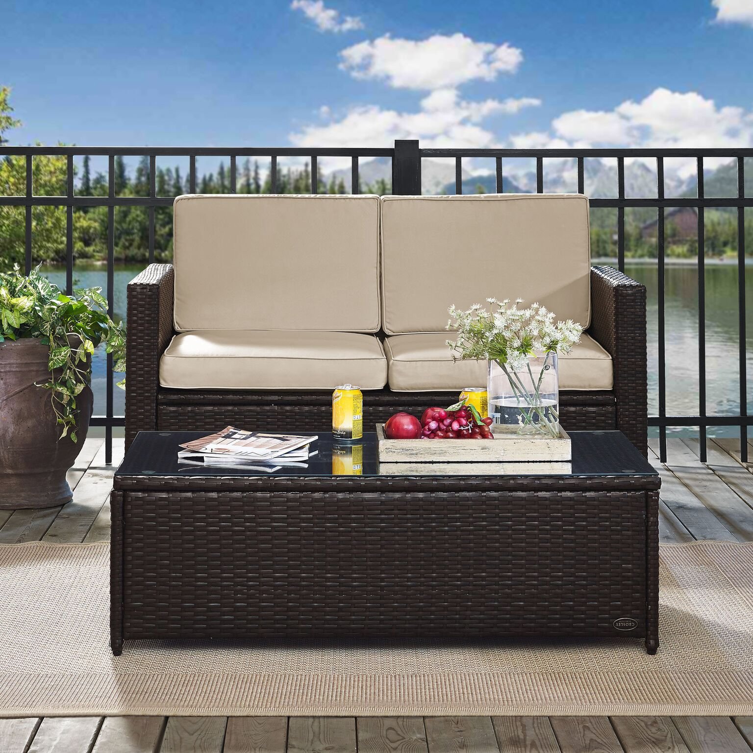 Crosley Furniture Palm Harbor 2-Piece Wicker Outdoor Coffee Table and Loveseat Patio Furniture Set for Porch, Brown with Sand Cushions