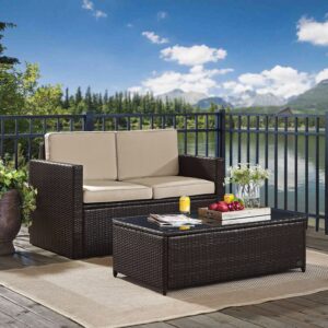 Crosley Furniture Palm Harbor 2-Piece Wicker Outdoor Coffee Table and Loveseat Patio Furniture Set for Porch, Brown with Sand Cushions